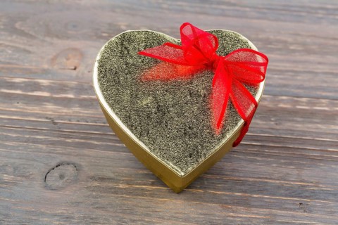 A box for a gift in the shape of a heart. Symbolic photo for Valentine's Day, wedding anniversary,