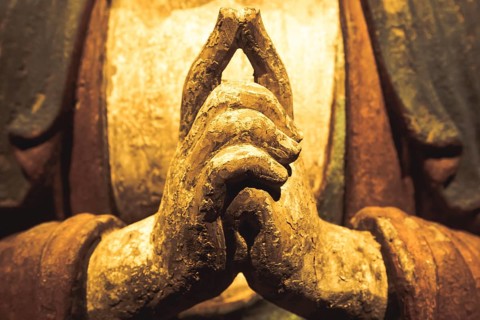 Buddha Statue, Concept of Zen, Spirituality, Peace. Hands gesture, texture light