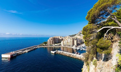 Montecarlo, Monaco, August 2022: panoramic view of the Fontvielle port with blue sky and sea,