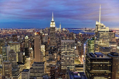 Rockefeller Center observation deck, panoramic view of the dense New York City skyline, lights of