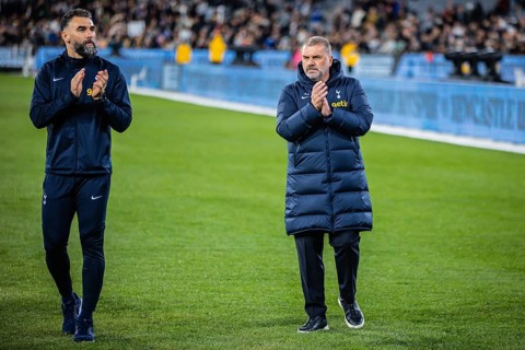 MELBOURNE, AUSTRALIA, MAY 22: Mile Jedinak and Ange Postecoglou of Tottenham Hotspur after losing