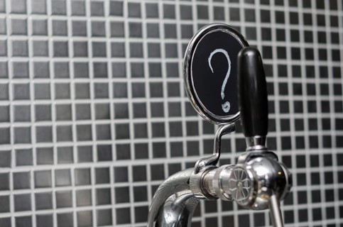 Beer tap with medallion with question mark as description