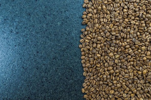 Texture, background of whole coffee beans, raw