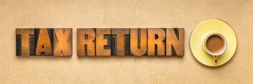 Tax return banner - word abstract in vintage letterpress printing blocks against textured paper