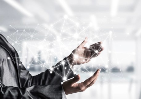 Business woman in suit keeping white social media network structure in hands with office view on