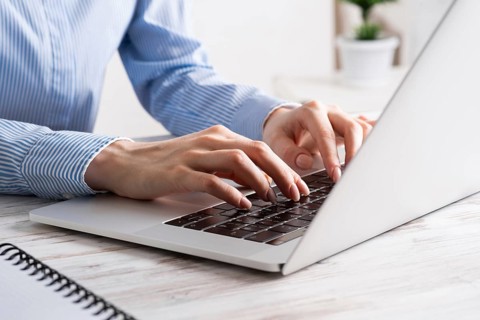 Office manager working with laptop. Corporate office workplace with computer. Business occupation