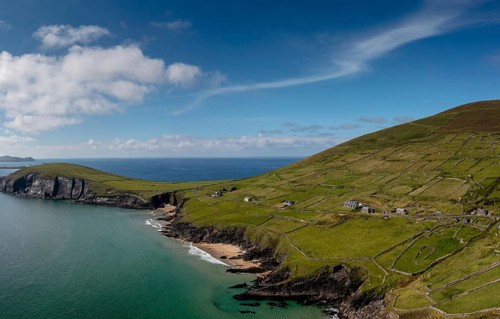 Landscape view of the turquoise waters and golden sand beach at Slea Head on the Dingle Peninsula