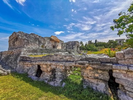 Ancient Tulum ruins Mayan site with temple ruins pyramids and artifacts in the tropical natural