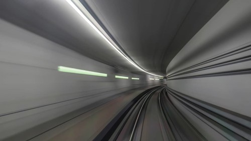 View on subway rails in tunnel from train