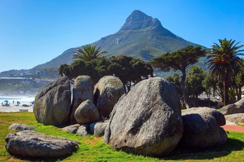 Promenade and beach in fabulous port city. Cape Town at the foot of Table Mountain. Coastline,