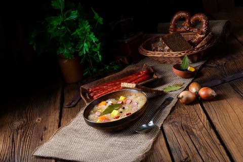 Rustic sauerkraut soup with bacon and sausage