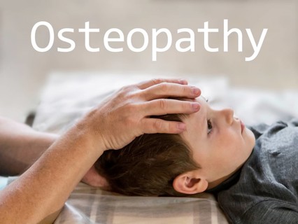Osteopathy Treatment and word Osteopathy. Elementary age boy's forehead being manipulated by real