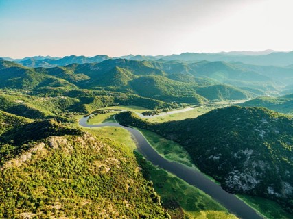Crnojevica river canyon among green mountains. Aerial view.