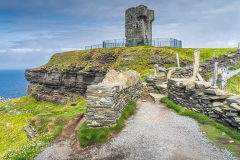 Old Moher Tower on Hags Head, watchtower at the southern end of Cliffs of Moher, popular tourist