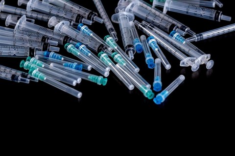 Medical Sterile Syringes Needles, Close up Syringes on Black Background