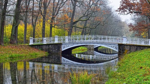 Autumn landscape in Catherine Park, Pushkin, Russia, view of the river and the bridge, Europe