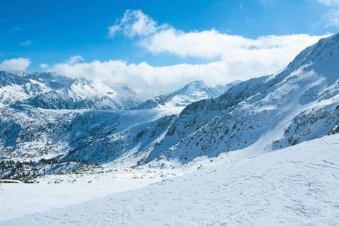 View on top of Pirin mountains from cable car, ski resort Bansko, Bulgaria.