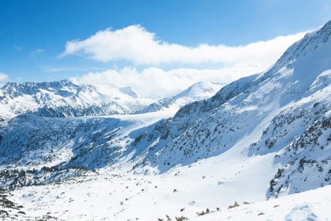 Tops of Pirin mountains view from top of cable car, ski resort Bansko, Bulgaria.