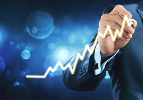 Close view of businessman drawing on screen growing graph