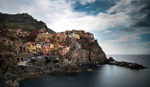 Picturesque and romantic village of Manarola with colourful houses and small beautiful port at