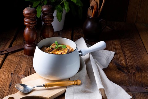 Veal goulash with baked aubergine and herbs