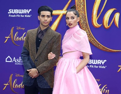 Mena Massoud and Naomi Scott at the Los Angeles premiere of 'Aladdin' held at the El Capitan