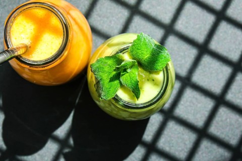 Seasonal Matcha green vegan smoothie with chia seeds and mint pumpkin carrot smoothie drink detox