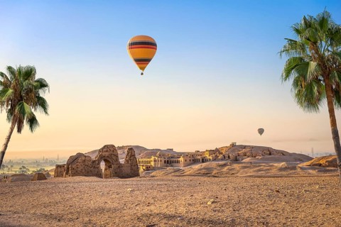 Hot air balloon over ruins of Hatshepsut temple in Luxor, Egypt, Africa