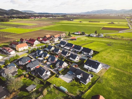 Drone view, aerial shoot of new build houses in the suburbs of Slovenia, somewhere in the country