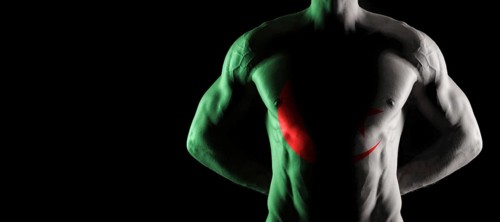 Algeria flag on muscled male torso with abs, black background