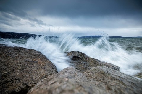 Waves crashing against rocks with dramatic sky in the background, harbour, Mittelzell, Reichenau,
