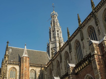 Gothic church architecture and church tower against the clear blue sky, haarlem, netherlands