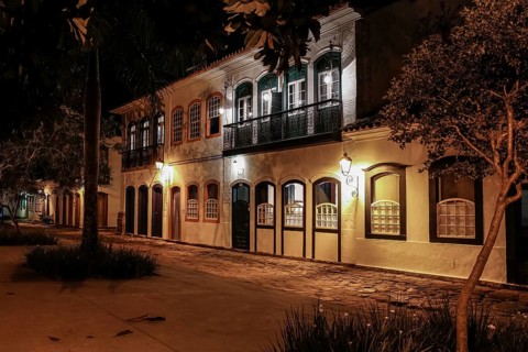 Atmospheric night view of illuminated street and buildings in historical center of Paraty, Brazil,