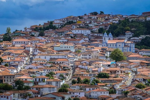 Close-up aerial view with sunshine, shadow and clouds to the historic town center of Diamantina,