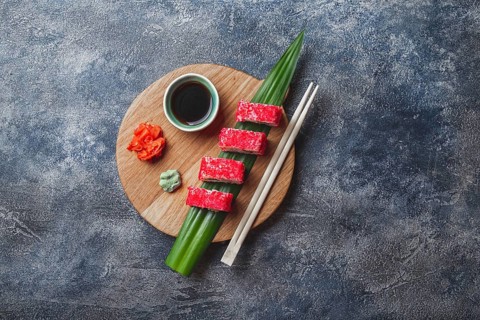 Food, Food, Sushi rolls on wooden board. Stone background. Top view