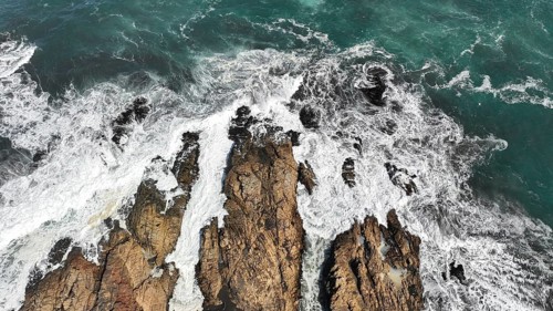 Drone aerial view of arco Calan coast near Constitucion Chile, Pacific ocean, Top view