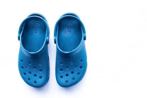 Calgary, Alberta, Canada. Nov. 19, 2020. Top View of Blue Crocs footwear, foam clog shoes on a