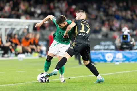 MELBOURNE, AUSTRALIA, MAY 24: Ben Parkinson of Newcastle United competes with Benjamin Garuccio of