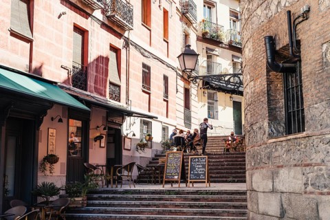 Madrid, Spain, October 11, 2020: Cozy bar in the steps of Travesia del Nuncio Street in central
