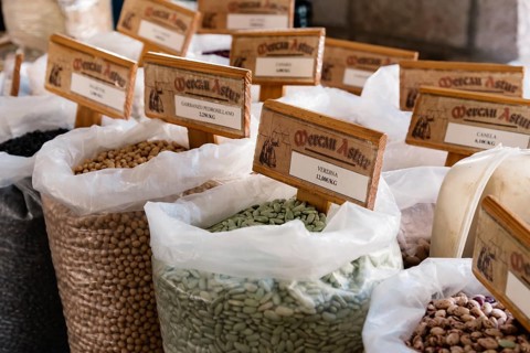 Cangas de Onis, Spain, March 31, 2019: Assortment of beans and other legumes in sacks in food