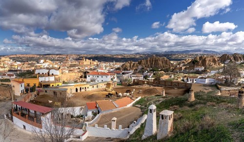 Guadix, Spain, 24 February, 2024: panorama view of the troglodyte houses in the Barrio de Santiago