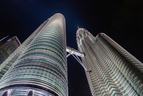 A picture of the Petronas Twin Towers as seen from below at night