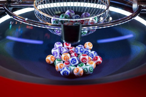 Colourful lottery balls in a rotating bingo machine
