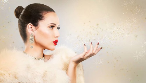 Upscale woman wearing gold jewellery and red lipstick on light background, Toronto, Canada, North