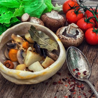 Vegetable hot plate made of baked dough cooked in a rustic style.Photo tinted