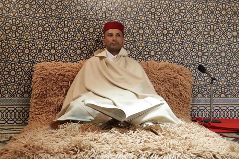 Rabat, Morocco - 29 November 2018: Koran reader sits in The Mausoleum of Mohammed V which is a