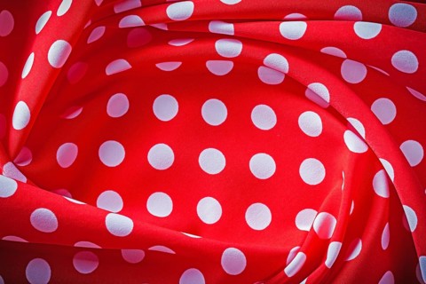 Red polka-dot fabric holidays concept