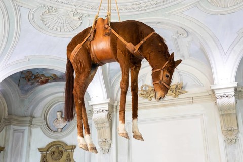 Rivoli, Italy, June 2022: Maurizio Cattelan provocative contemporary art, Novecento, Europe
