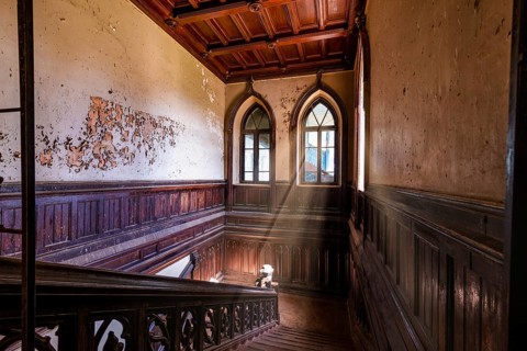 Wooden staircase in abandoned Sharovskiy Castle, Kharkov region. Ukraine