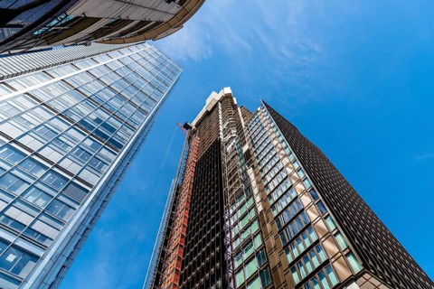 London, UK, May 14, 2019: Low angle view of office buildings under construction in the City of
